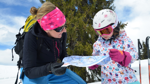 Julie Slaughter and her daughter dressed in ski attire.